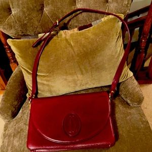 Cartier shoulder bag.  Burgundy. Used.